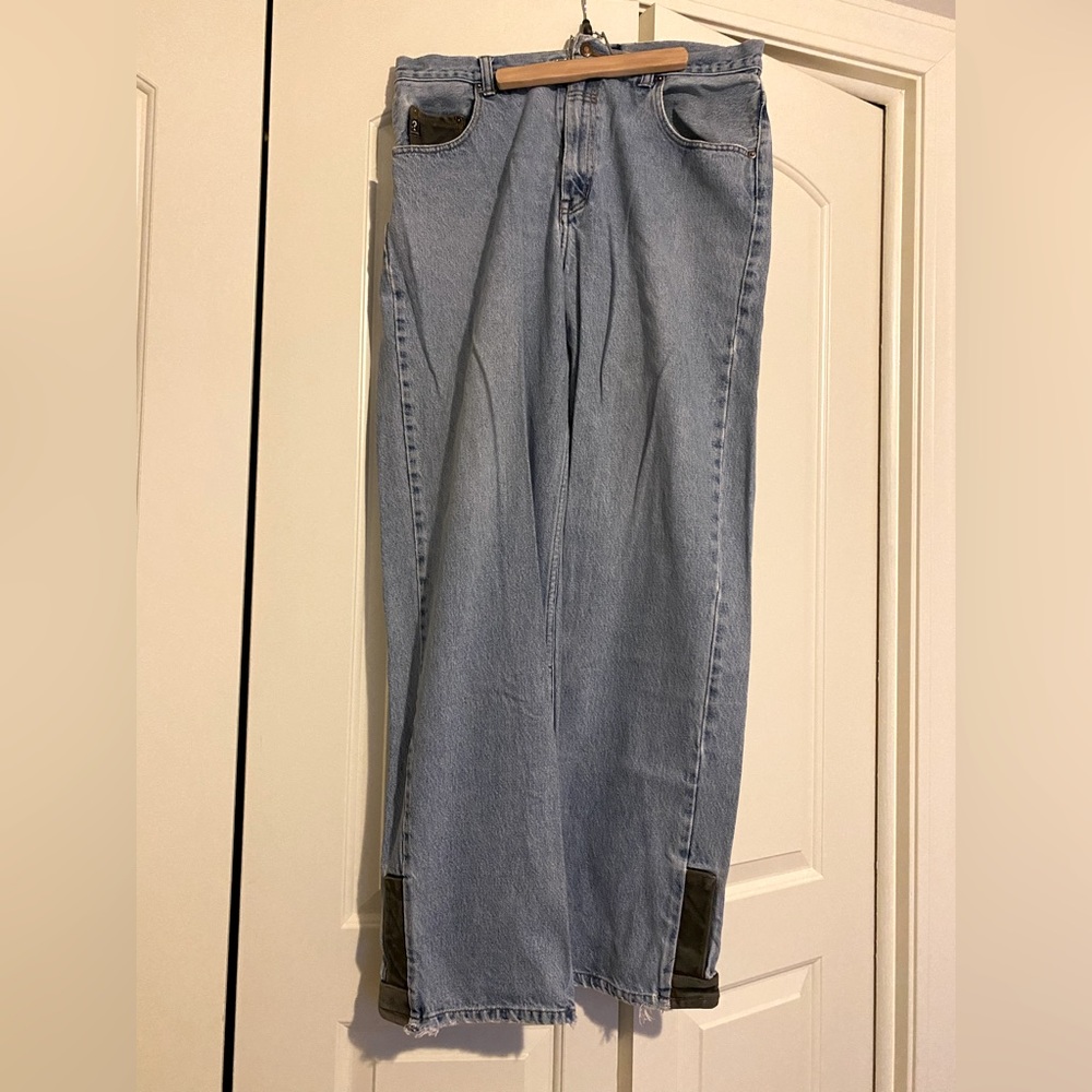 Guess 36 x 34 jeans with leather accents on right front pocket and cuffs;